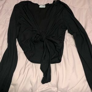 Black shirt with adjustable front wraps. Size XL